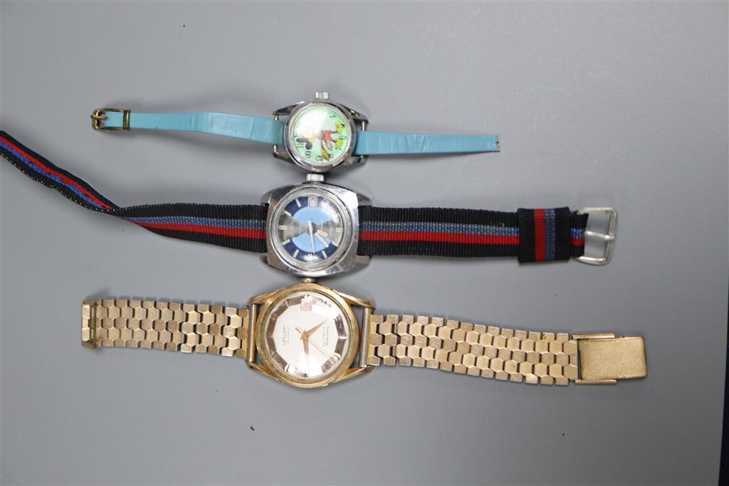 Three assorted wrist watches including Felca, Timex and ladys Mickey Mouse.